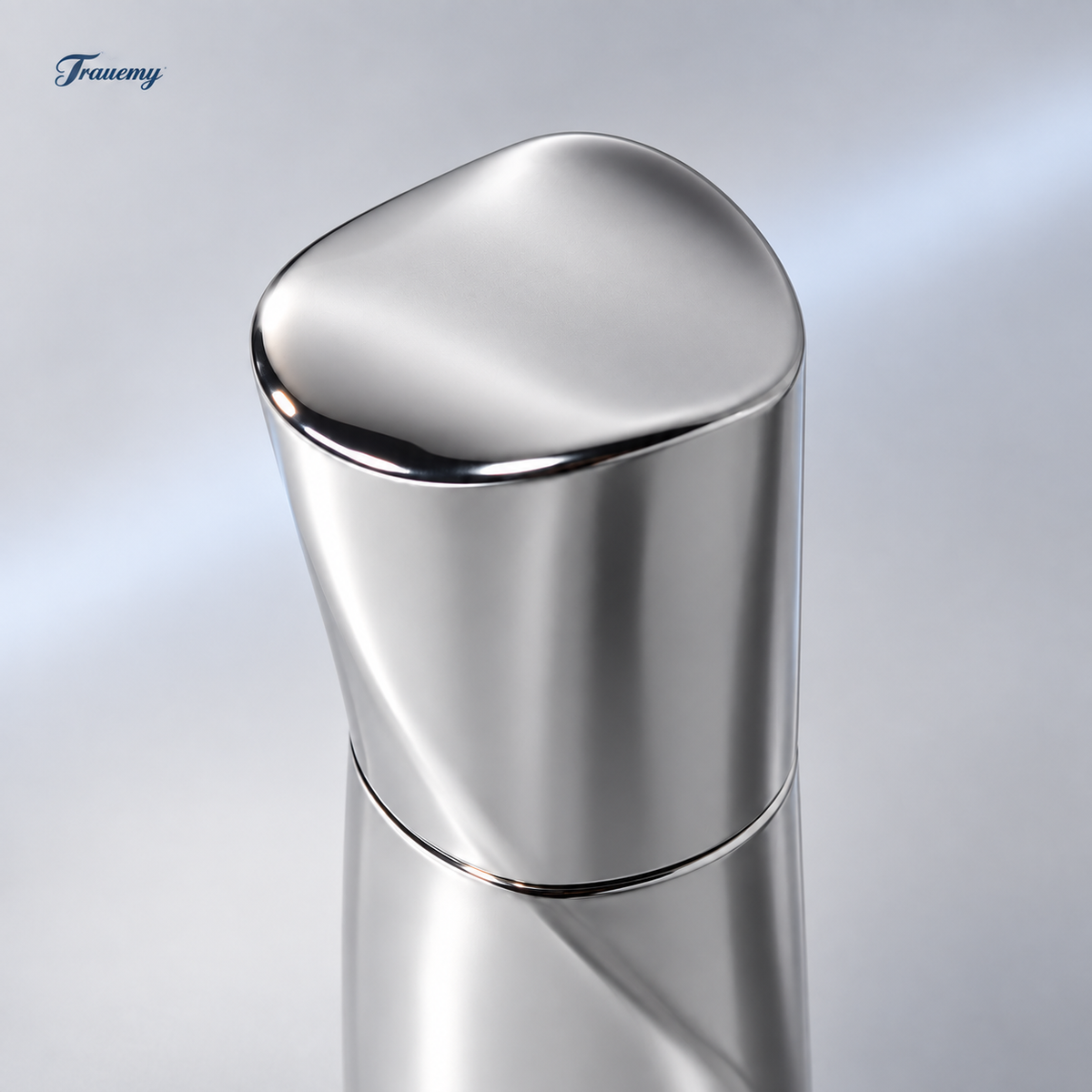 TRAUER facial serum bottle detail: reflective silver closed cap and curved shoulder seam